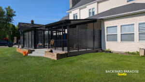 Pergola, sunroom, and outdoor kitchen, who said you can't have it all?