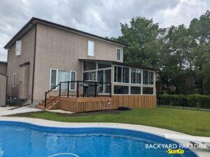 Sandalwood and white studio sunroom with black aluminum railings , Stonewall, Manitoba 4