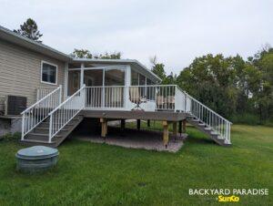 White studio sunroom with composite deck and white aluminum railing ,Balmoral, manitoba 2