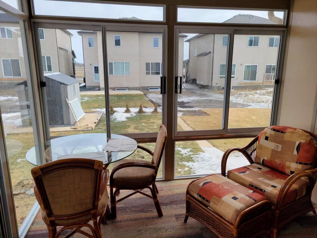snadalwood and white studio sunroom by SunCo in West St. Paul, Manitoba